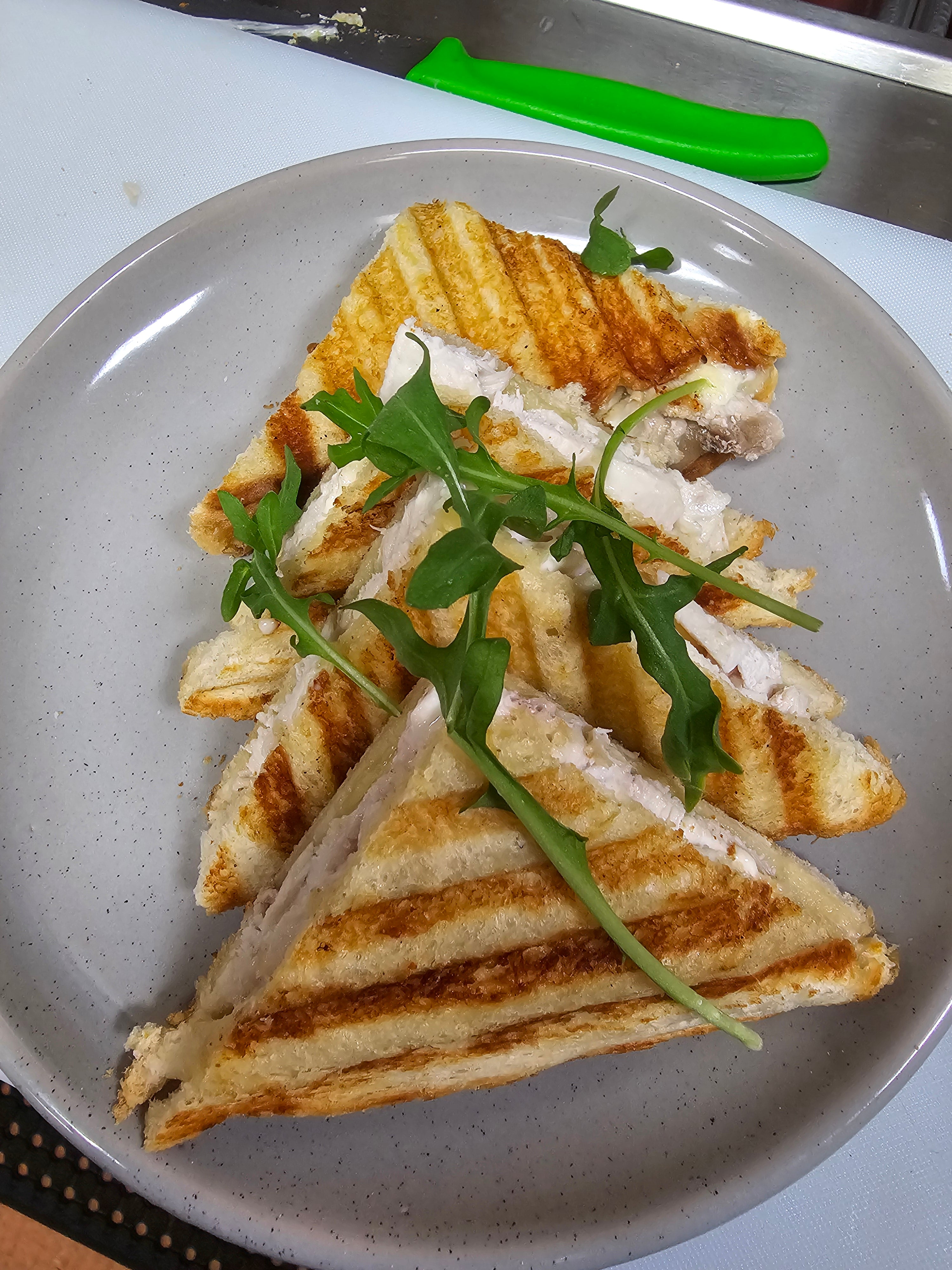 Build your own toasted sandwich with ham, chicken, cheese, avocado, tomato, onion, pineapple, and mayo at The Social Cafe in Emerald QLD 4720.