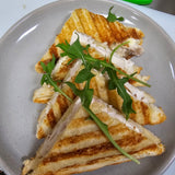 Build your own toasted sandwich with ham, chicken, cheese, avocado, tomato, onion, pineapple, and mayo at The Social Cafe in Emerald QLD 4720.