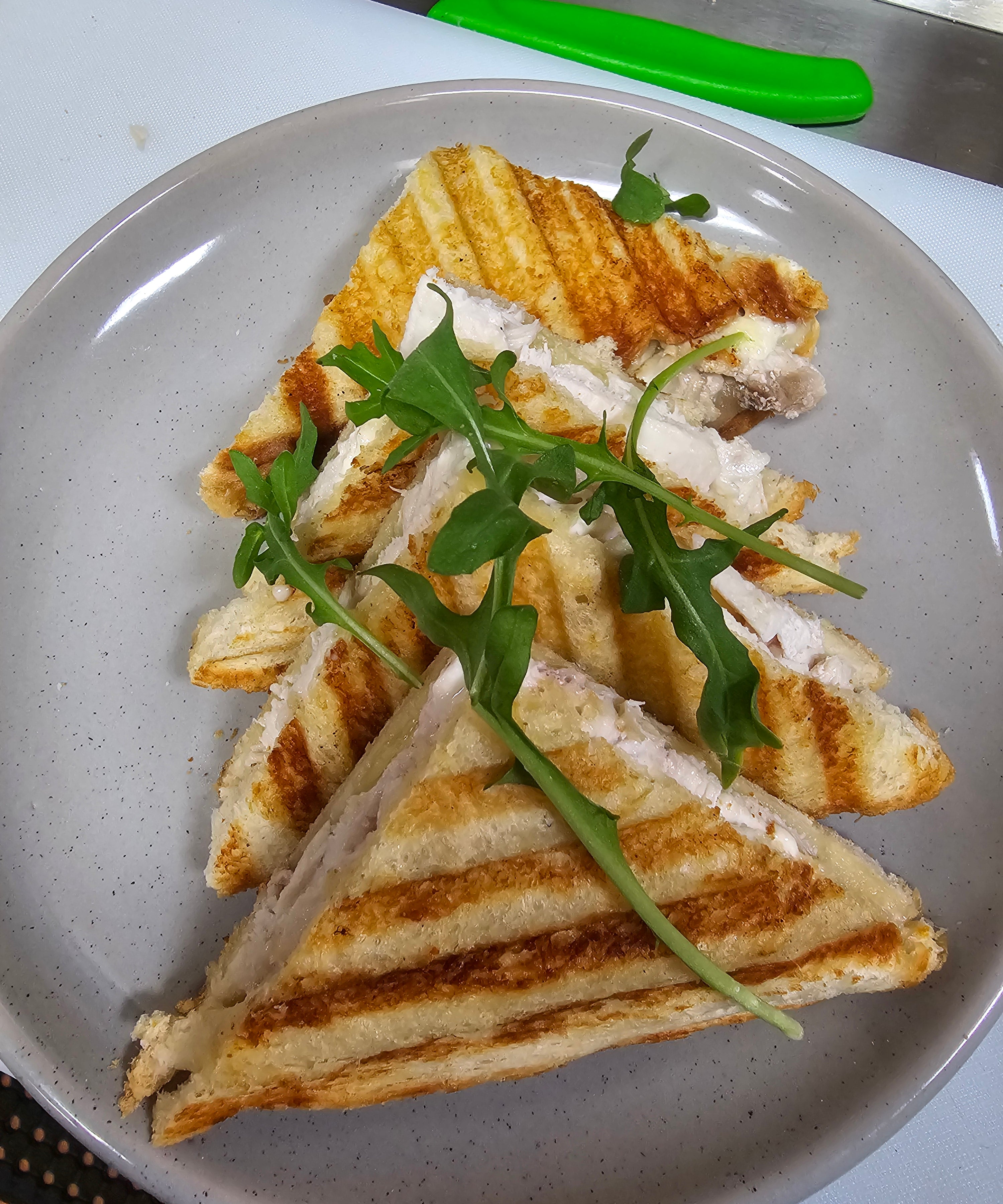 Build your own toasted sandwich with ham, chicken, cheese, avocado, tomato, onion, pineapple, and mayo at The Social Cafe in Emerald QLD 4720.