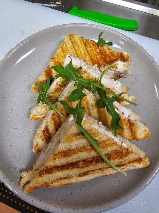 Build your own toasted sandwich with ham, chicken, cheese, avocado, tomato, onion, pineapple, and mayo at The Social Cafe in Emerald QLD 4720.