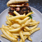 Burger Hill loaded beef burger with bacon, egg, cheese, vegetables, and chips from The Social Cafe in Emerald QLD 4720.