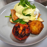 Terry Benedict with poached eggs, spinach, toasted Turkish bread, choice of bacon, ham, pulled pork, smoked salmon, or halloumi, grilled tomato, and homemade hash brown at The Social Cafe in Emerald QLD 4720.