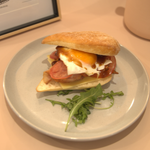 Bacon, egg, and cheese sandwich with tomato and BBQ sauce from The Social Cafe in Emerald QLD 4720.